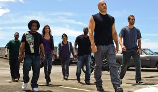Fast Five Vin Diesel and Paul Walker lead their family on the tarmac