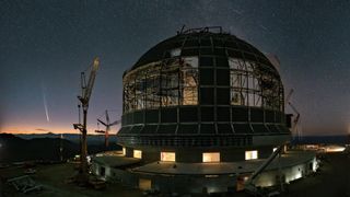 a large domed structure under a starry night sky, with a fuzzy trail of light on the left side of the image