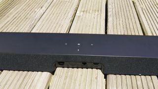 The top of the Sonos Beam soundbar on a wooden surface