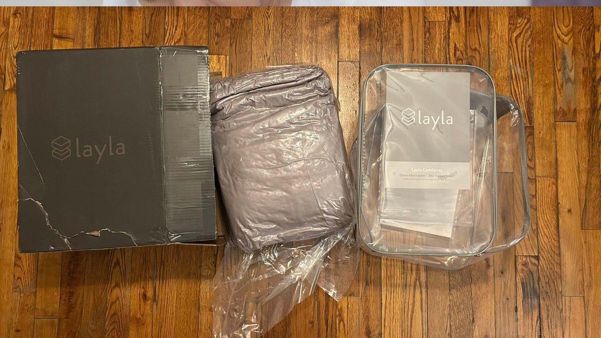 The image shows the Layla Down Alternative Comforter straight out of the box
