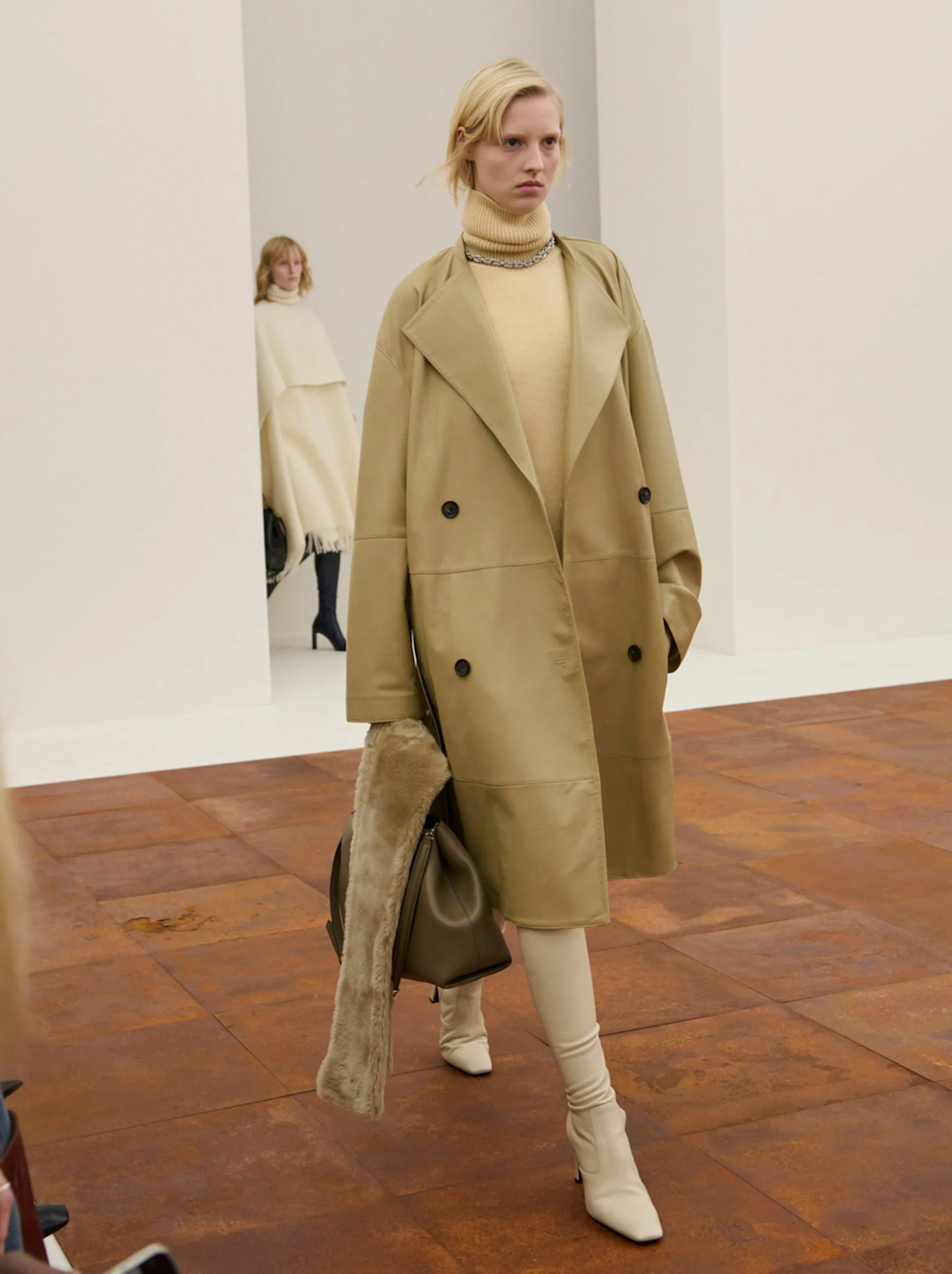 A model wears sock boots on Toteme&#039;s autumn/winter 2025 runway