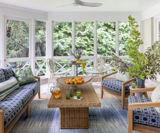 screened porch with blue furniture