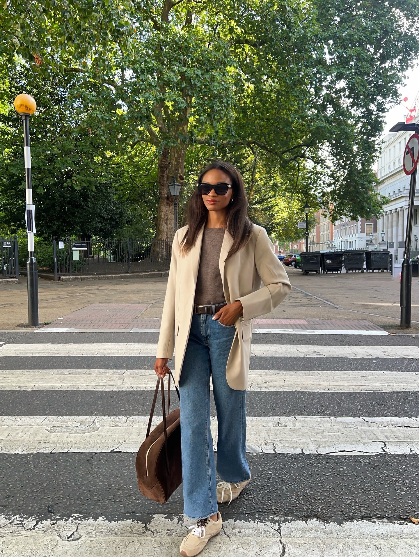 @lornasymphony wearing blue jeans, brown short sleeve, blazer, and suede sneakers