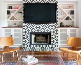 Patterned monochrome fireplace tile idea in a midcentury style living room designed by Lauren Ramirez Interiors