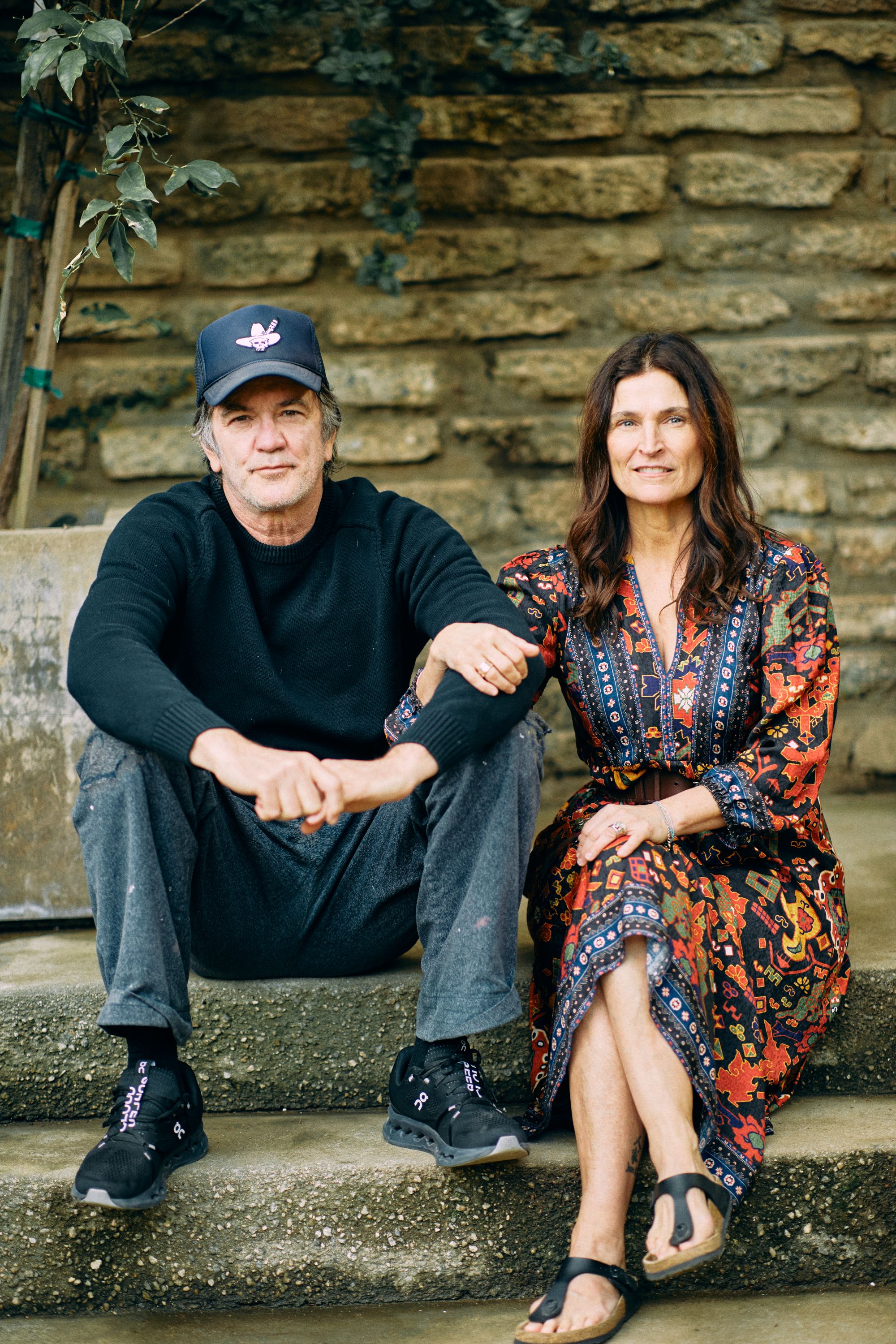 a man and a woman sitting on steps