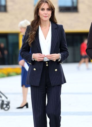Kate Middleton wearing a pinstripe blazer.