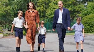 Prince George, Princess Charlotte and Prince Louis (C), accompanied by their parents William, The Prince of Wales and Catherine the Princess of Wales arrive for a settling in afternoon at Lambrook School, near Ascot on September 7, 2022 in Bracknell, England.