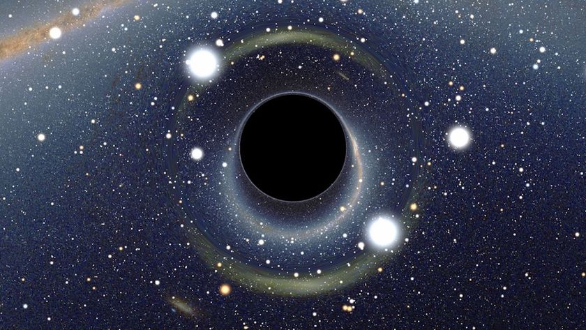 An illustration of a black hole in front of starry outer space