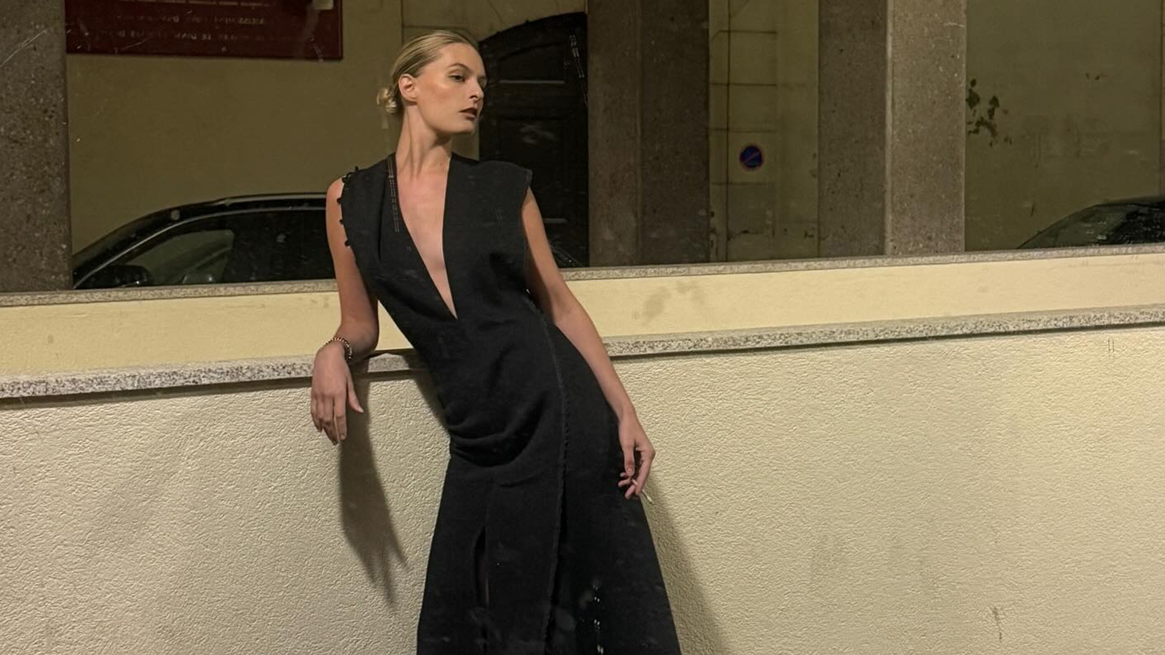 Christie Tyler wearing a black tie dress.