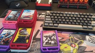 An array of custom Steam game cartridges laid out on a desk