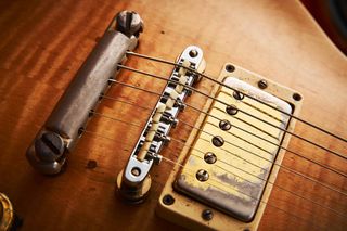 The guitar’s current owner has refitted the nylon saddle-equipped bridge to the guitar that was in the case when he acquired it. Koss was said to prefer the sound of nylon saddles.