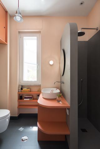 A bathroom with sink partition