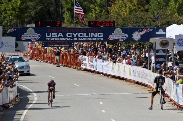 Taylor Phinney (Trek Livestrong/U23) watches as Levi Leipheimer (Radioshack) crosses the line.