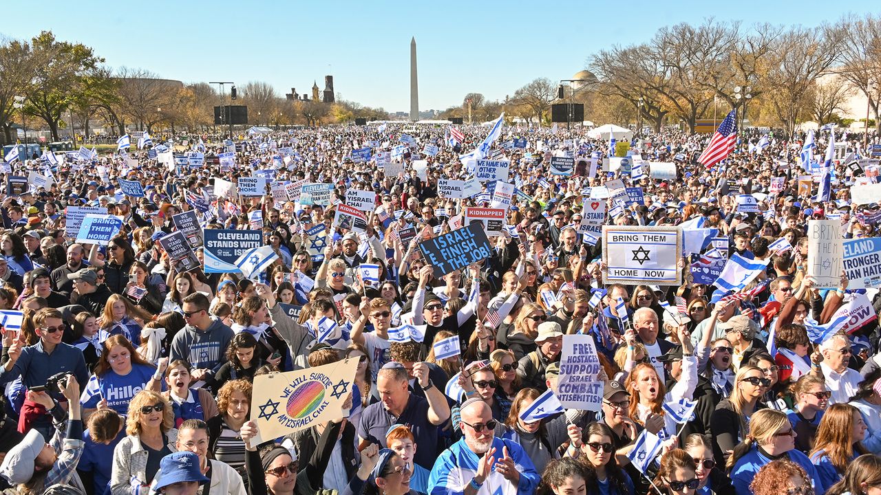 People hold signs and flags during &#039;March For Israel&#039; at the National Mall