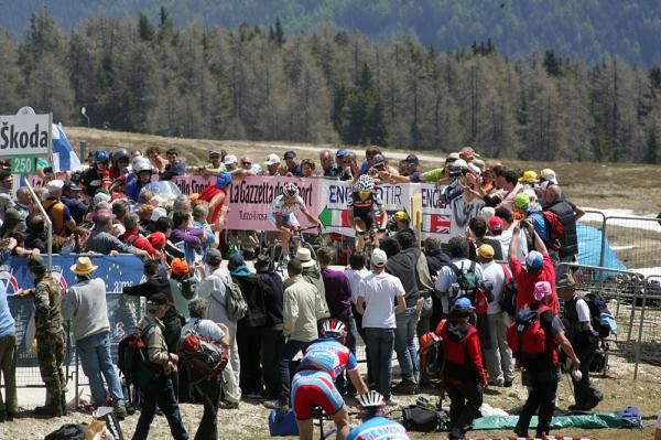 Fans cheer Bertolini through the final turn of the Plan de Corones TT