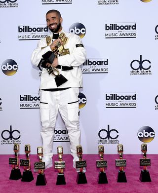 Drake trying to hold his 2017 Billboard Music Awards