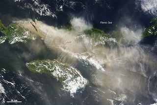 Ash from the Sangeang Api volcano in Indonesia drifts southeast in this NASA satellite image, captured May 31, 2014.