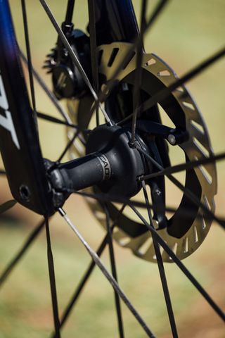 An image of a Cadex hub and carbon spokes on a Giant Propel bike