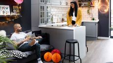 open plan kitchen/living space with grey kitchen units decorated for Christmas