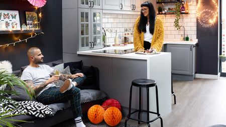 open plan kitchen/living space with grey kitchen units decorated for Christmas