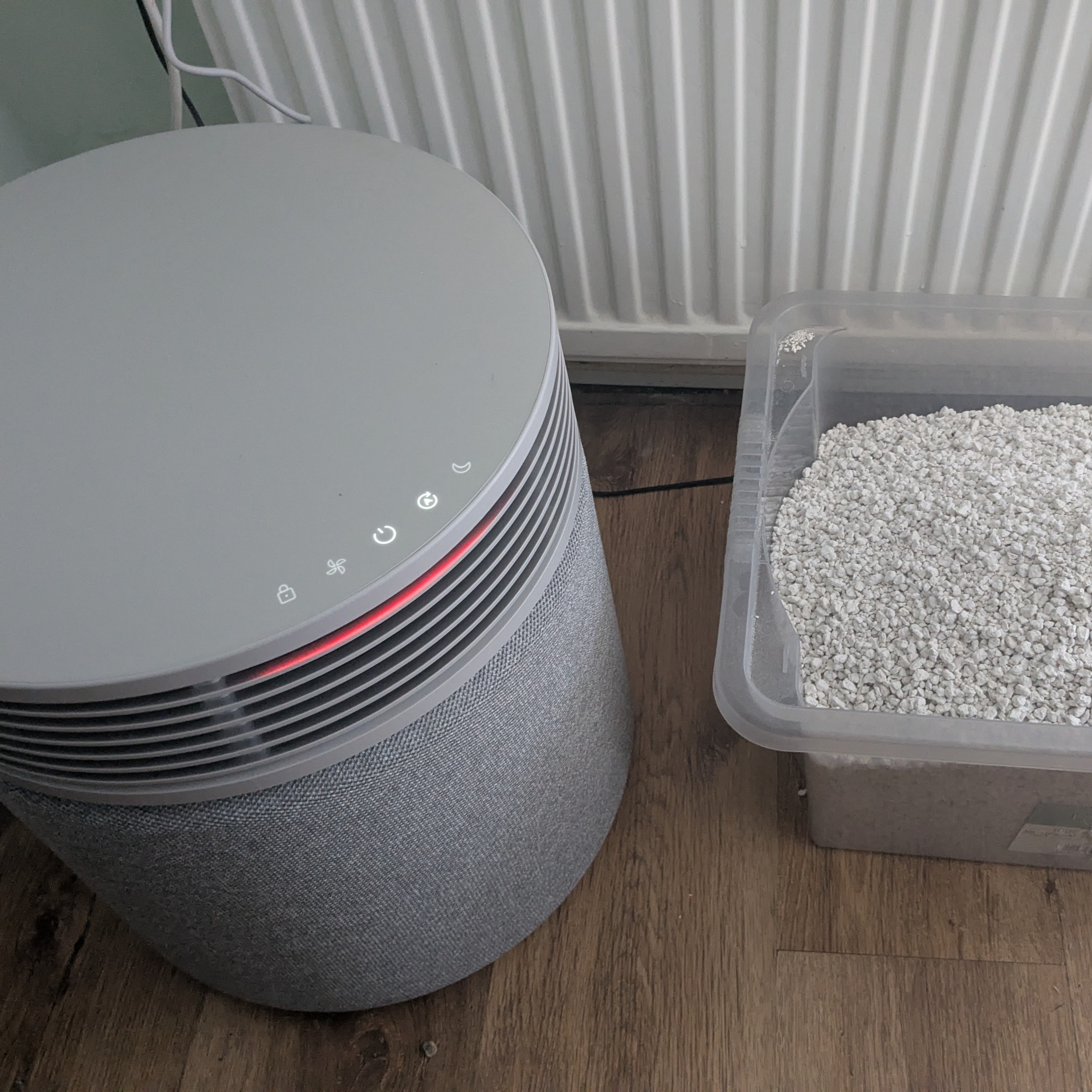 Blueair Blue Signature pictured next to large container of cat litter