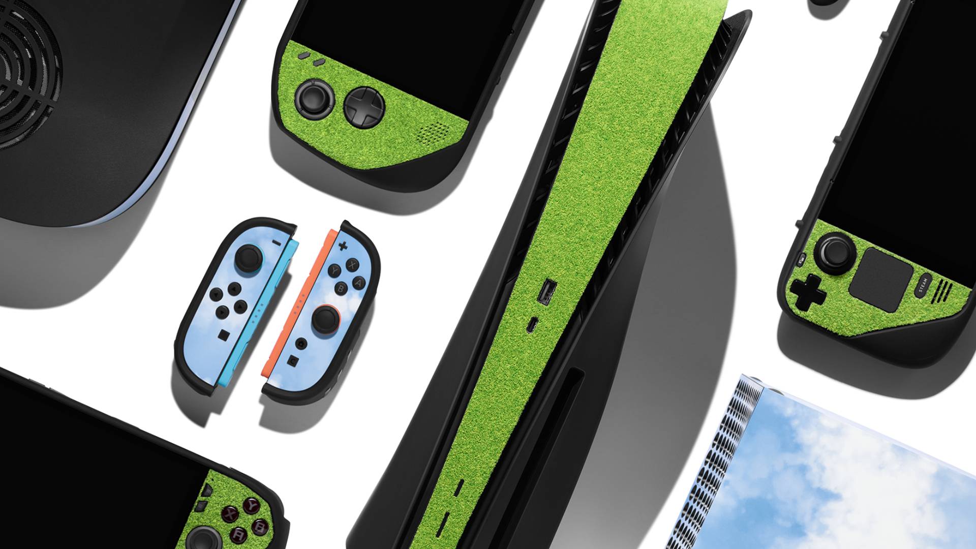 Image of a collection of devices including the Switch 2 Joy-Cons with the Touch Grass and Blue Sky dbrand skins attached.