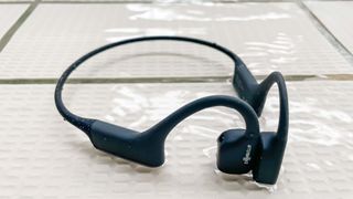 Shokz OpenSwim / Best waterproof headphones shown poolside