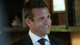 Gabriel Macht smiling as Harvey Specter in Suits LA
