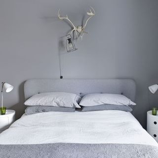 bedroom with grey wall and pillows