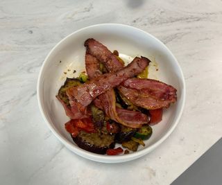 Bacon and Mediterranean vegetables in a bowl.