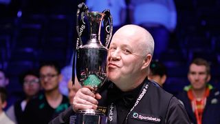 John Higgins of Scotland poses with his trophy after winning the Final match against Mark Selby of England on day seven of 2025 Sportsbet.io Tour Championship at Manchester Central Convention Complex on April 6, 2025 in Manchester, England. 