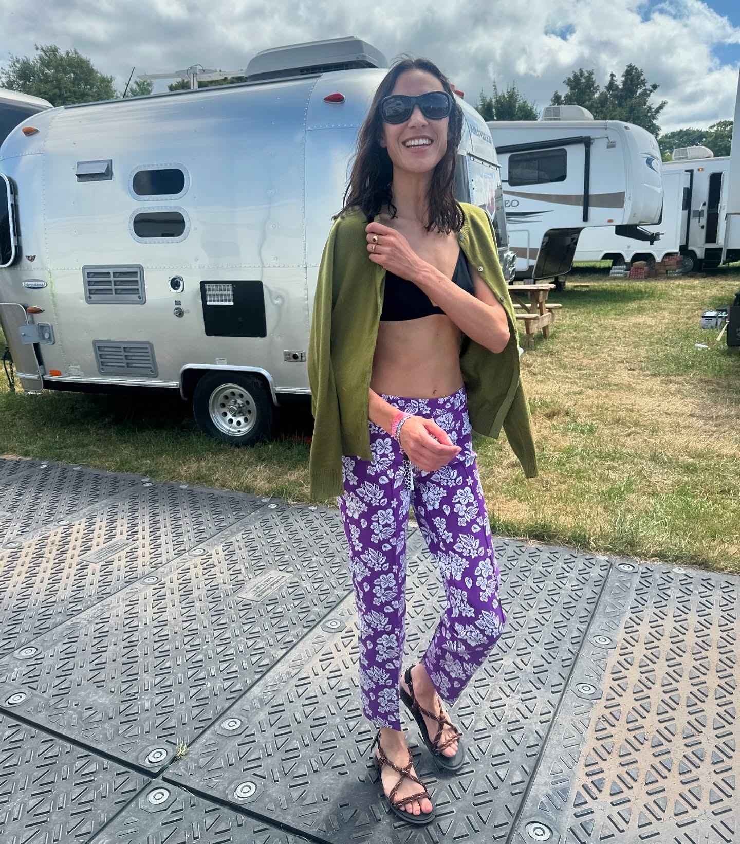 Alexa Chung wearing printed skinny pants at Glastonbury