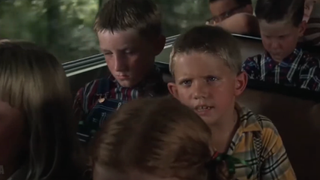 Kids tell Forrest he can't sit down on the bus.