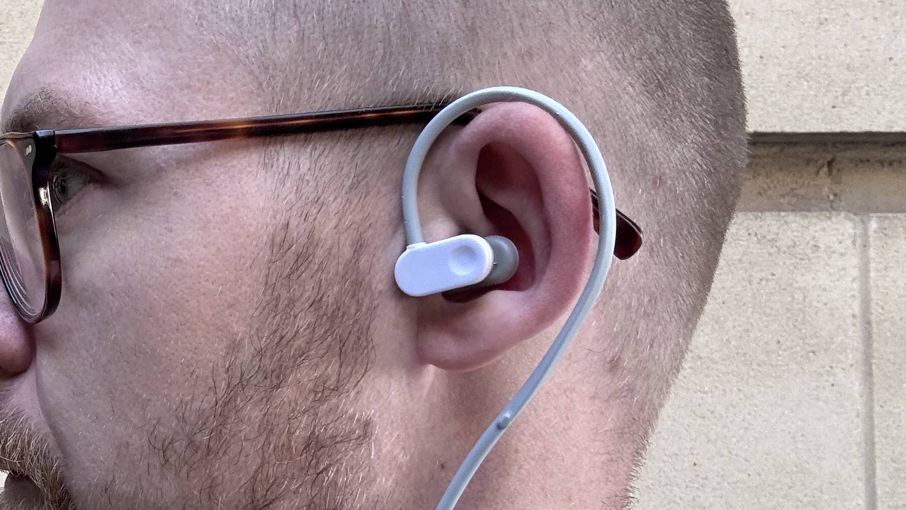 Nurosym clamped onto caucasian man's tragus