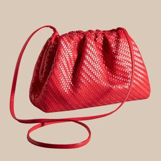 flat lay image of red clutch bag