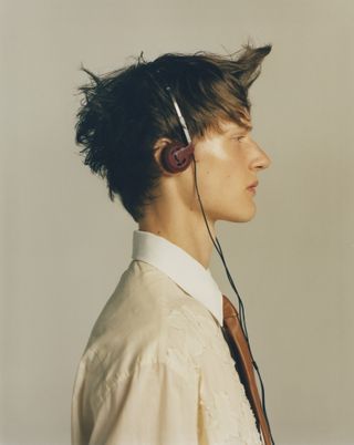 Resort 2025 looks on models wearing headphones