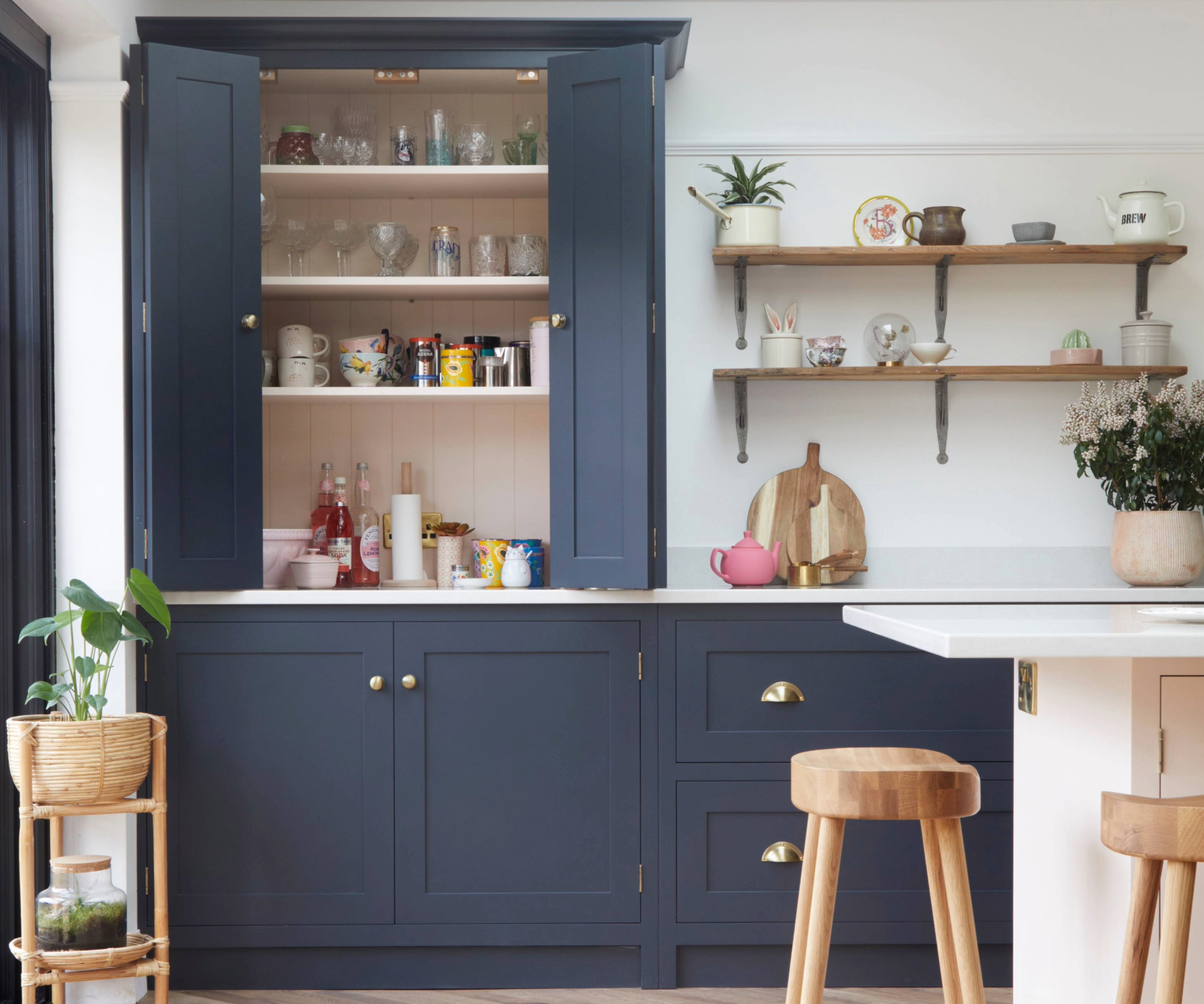 Kitchen with open shelving and a wall cabinet with the doors open