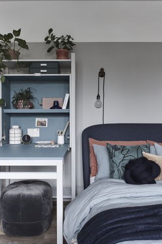 bedroom with grey wall and bed