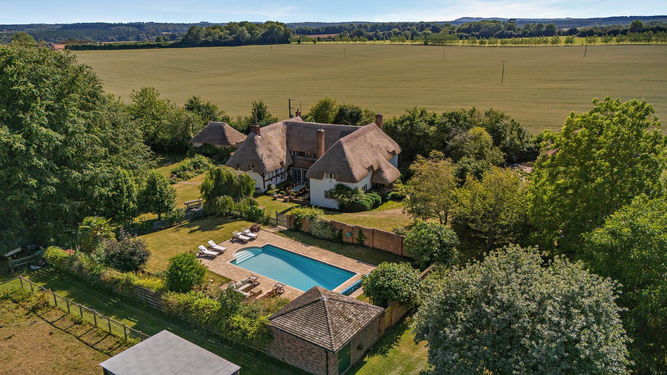Five wonderful homes, from a thatched wonder to a house with its own bluebell wood, as seen in Country Life