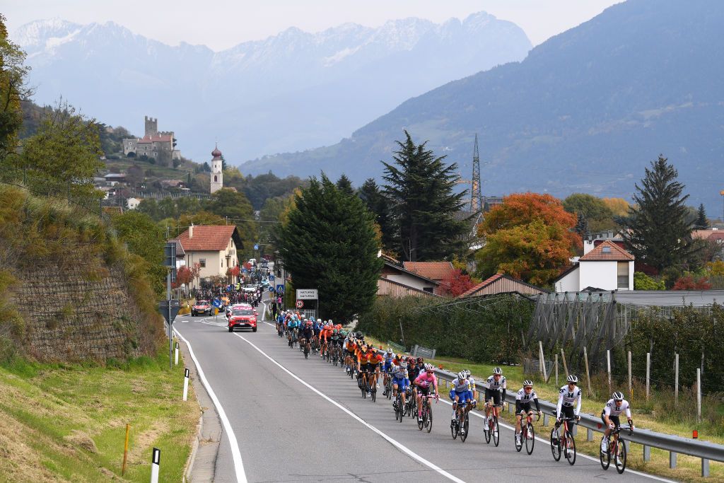 LAGHI DI CANCANO ITALY OCTOBER 22 Nico Denz of Germany and Team Sunweb Chad Haga of The United States and Team Sunweb Sam Oomen of The Netherlands and Team Sunweb Martijn Tusveld of The Netherlands and Team Sunweb Mikkel Honore of Denmark and Team Deceuninck QuickStep Joao Almeida of Portugal and Team Deceuninck QuickStep Pink Leader Jersey Naturns Naturno Village Juval Castle Peloton Landscape Mountains during the 103rd Giro dItalia 2020 Stage 18 a 207km stage from Pinzolo to Laghi di Cancano Parco Nazionale dello Stelvio 1945m girodiitalia Giro on October 22 2020 in Laghi di Cancano Italy Photo by Tim de WaeleGetty Images