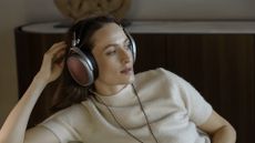 Woman wearing Meze POET headphones