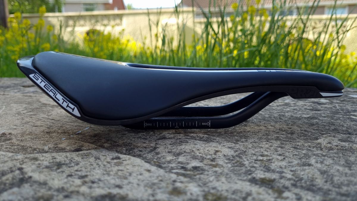 A close up of the Pro Stealth Carbon Saddle on a stone floor