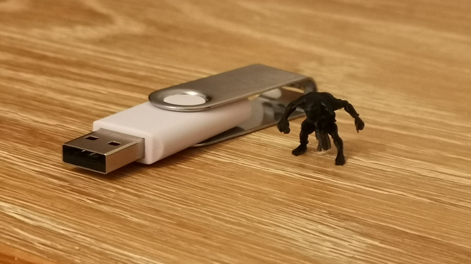 A size comparison between a goblin printed on the Elegoo Saturn and a standard USB drive