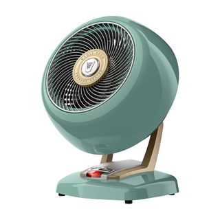 A bluey green circular retro space heater