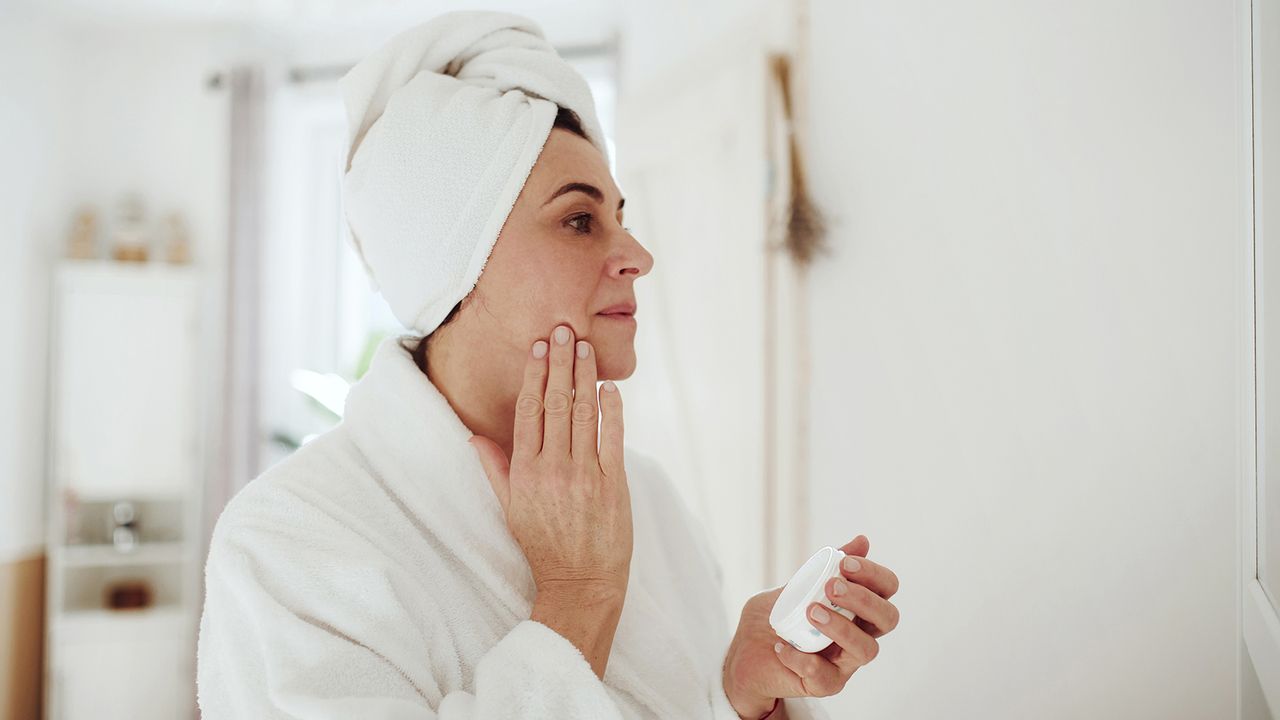 woman applying face cream