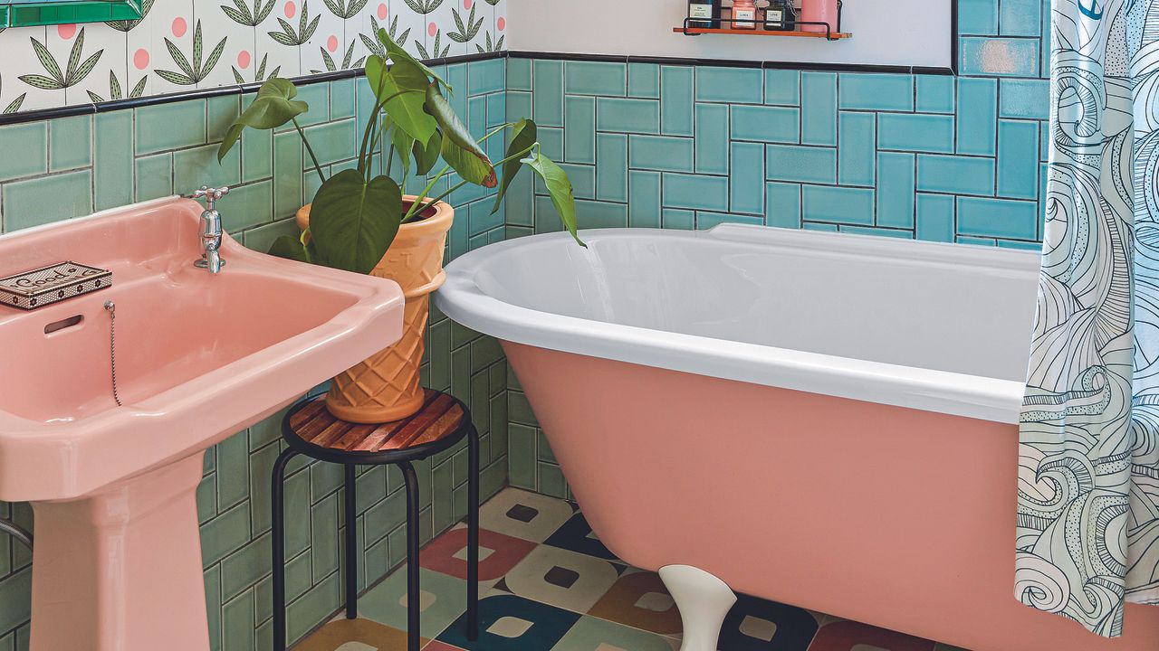 Bathroom with pink bathrub and sink