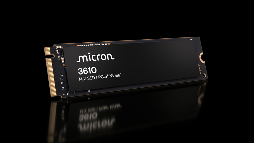 The Micron 3610 SSD rests on a reflective surface on a black background.
