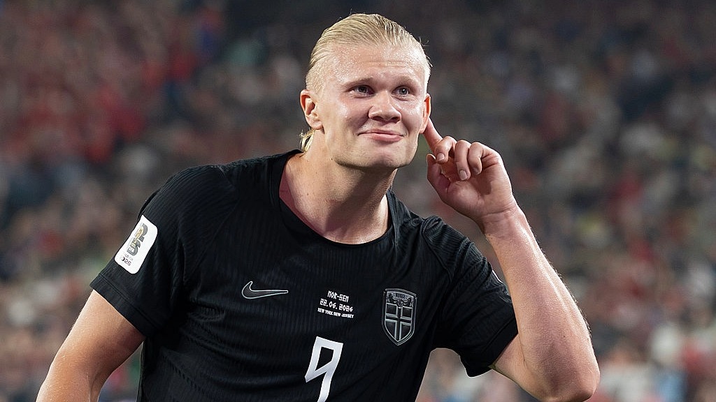 Erling Haaland, wearing Norway's black away kit, puts his finger to his ear after scoring for his country at the World Cup 2026.