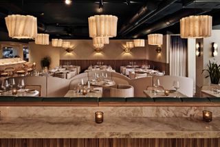 Interior of Sereia restaurant with sculptural ceiling lamps