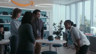 People look at an Alexa device in an Amazon commercial